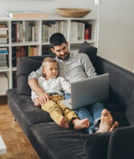 father and son with laptop