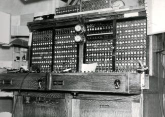 Old phone switchboard photo in black and white